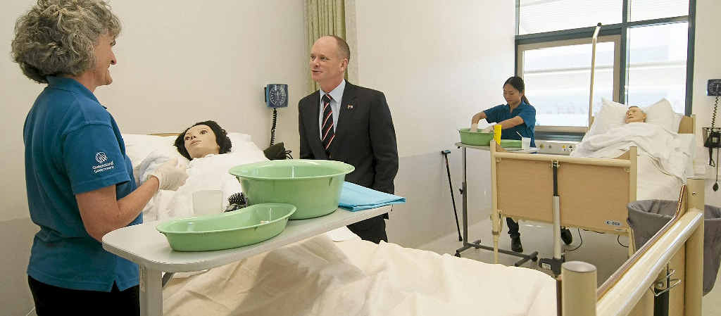 Queensland Premier Campbell Newman talks with a trainee at the aged car nurses training facility at the Southbank Institute of Technology. Queensland Premier Campbell Newman talks with a trainee at the aged car nurses training facility at the Southbank Institute of Technology.
